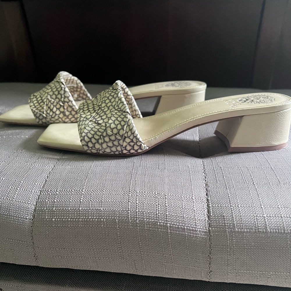 Vince Camuto snake print slides with low block heel.